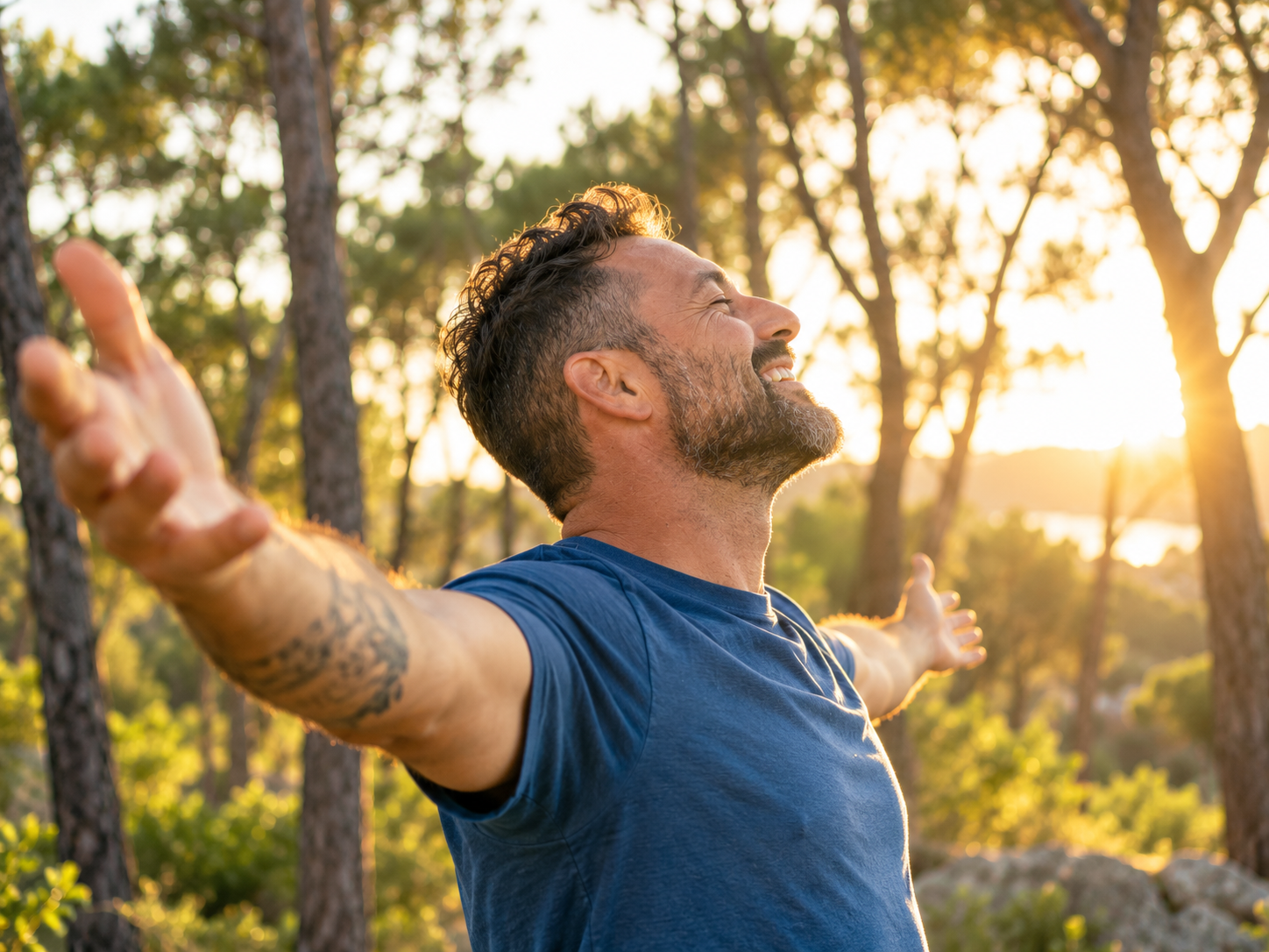 Man stretching his arms outdoors in the sunshine